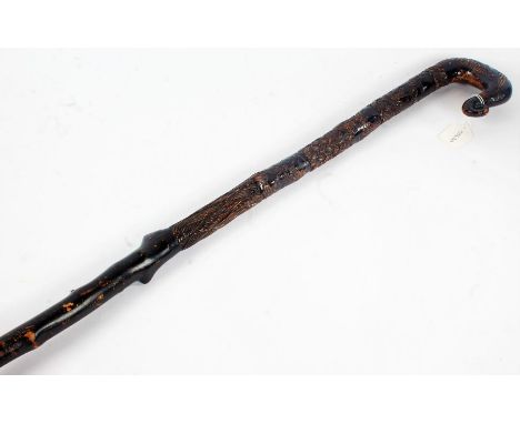 Highly decorative 19th Century walking stick, carved with the British and the Anderson family crest, various animals carved w