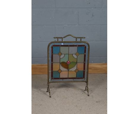 Early 20th century brass and leaded glazed fire screen, with brightly coloured glass panel (cracked), 48cm wide