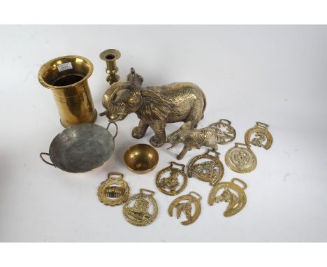 Large brass elephant, together with a WWI trench art vase dated 1916, quantity of loose horse brasses, 19th century brass can
