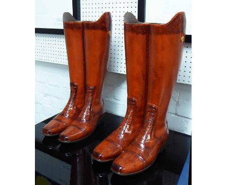 RIDING/WALKING STICK STANDS, two pairs, country estate boots design stylised finish, 48cm H x 25cm. 