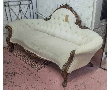 SOFA, mid Victorian walnut, circa 1860, with foliate carved frame, button back and serpentine seat in white patterned chenill