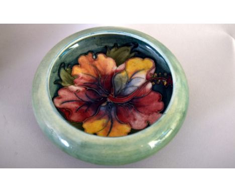 Moorcroft 'Clematis' pattern posy vase, green ground, impressed marks on base, 19cmH together with a round trinket dish with 