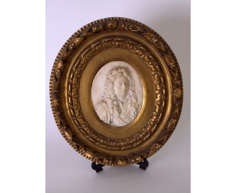 A Baroque white marble carved portrait bust of a gentleman wearing a full bottomed wig and classical toga, late 17th/early 18