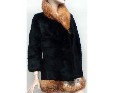 A vintage black rabbit fur jacket with fox fur trim to collar and hem two front pockets and lined. Good overall condition. si