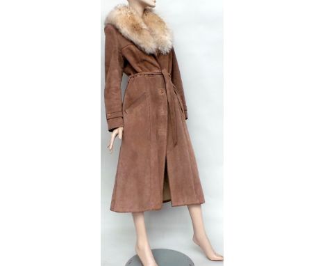 A 1970's ankle-length sheepskin coat with deep fur collar. Coat buttons through and has a tie belt - good vintage condition, 