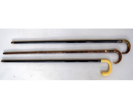 A George V silver and malacca walking stick, by Thomas Dicks, London 1915, with crook horn handle, with brass finial, 92cm, a