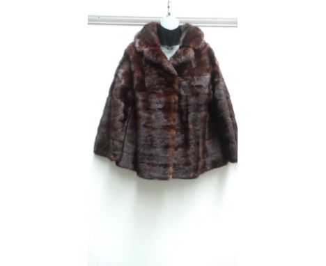 A 1950's/60's short mink fur jacket. The garment has some wear to the lining at the hem and sleeves although this is not noti