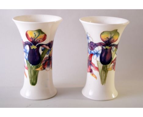 Two Moorcroft 'Orchid' pattern vases, cream ground, signed and impressed marks to bases. 16cmH together with a small trinket 