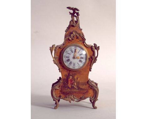 A late 19th / early 20th century French mantle clock, the enamel dial with Roman numerals and outer Arabic numerals, in gilt 
