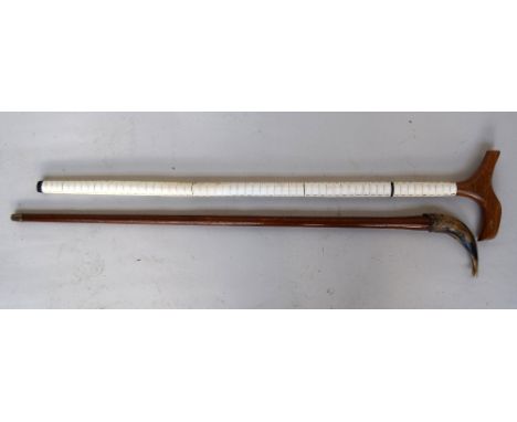 A Victorian sharks vertebrae walking stick, 86cm, with a walking stick with carved horn handle in the form of a fish, 89cm