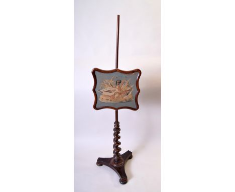 An early Victorian rosewood firescreen, embroidered with two duck, supported on twist stem and three splayed feet with bun fe