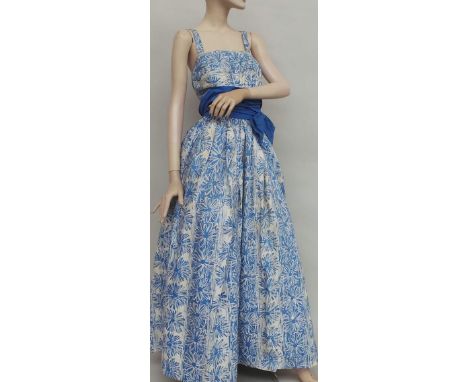 A pretty 1950s sanforized cotton full-length gown by 'Cresta' in a batik style floral print in blue and white. The fitted bod