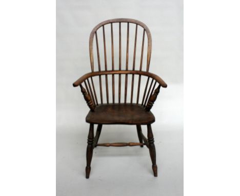 A 19th century ash and beech, comb back spindle Windsor armchair
