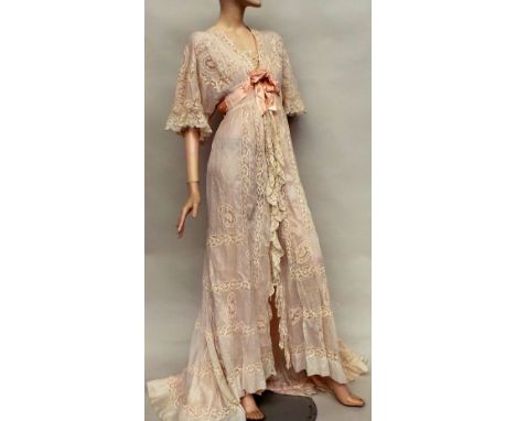 An early 1900s silk and lace negligee. A beautiful garment of cream fine cotton muslin and lace which fastens at the front of