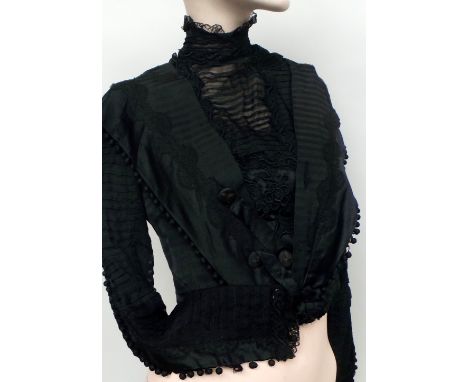 A black silk and lace Victorian bodice with beautiful detailing and covered button embellishment running down the sleeves and