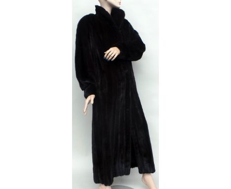 A vintage 1980's ankle-length Blackglama dark mink coat made for 'Davellin' of New York. The coat features a shawl collar whi