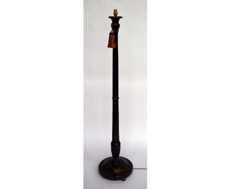 A Japanned laquered standard lamp, decorated with gilt village scenes