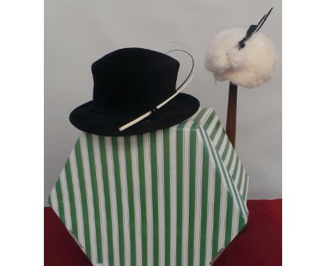 A stunning black felt hat by Frederick Fox with white and black feather. A further cream mink hat with black feather shafts, 