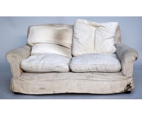 An early 20th century two seater sofa, in the manner of Howard & Son