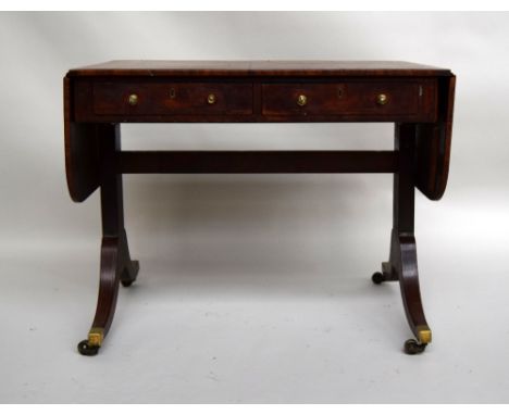 A George III mahogany and ebony strung sofa table, two frieze drawers on splayed legs and castors, 90cmW