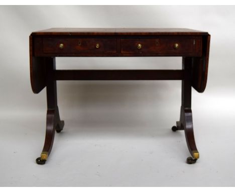 A George III mahogany and ebony strung sofa table, two frieze drawers on splayed legs and castors, 90cmW