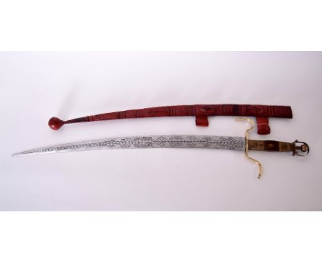 An early 20th century Tuareg/Berber curved sword and thick leather scabbard with traditional Saharah North African motifs, re