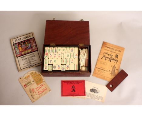 An early 20th century Mah Jongg set purhased in Hong Kong in 1924 together with The "Chad Valley" Score card and Calculator, 