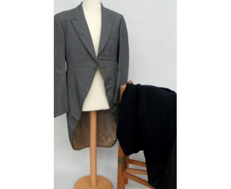Three vintage tail coats - two black (one dated 1928) and one grey. All in fair condition for their age. (3)