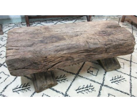 LOW TABLE, vintage oak seasoned weathered beam, on early carved sandstone architectural fragments supports, 128cm W x 55cm H.