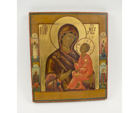 ICON, 19th century painted on wooden panel depicting mother of God and baby Christ with Gabriel and Saints in border, 36cm H 