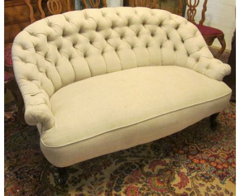 SOFA, late 19th century Continental mahogany with a buttoned, shaped back and beige upholstery on short cabriole front suppor