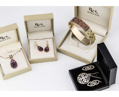 The Book of Kells collection of jewels, including a bangle, a pair of diamond earrings, and pendant, all gilt metal with a Ce