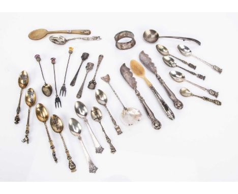 A collection of British and Continental spoons and other interesting items, including a carved horn spoon with silver applied