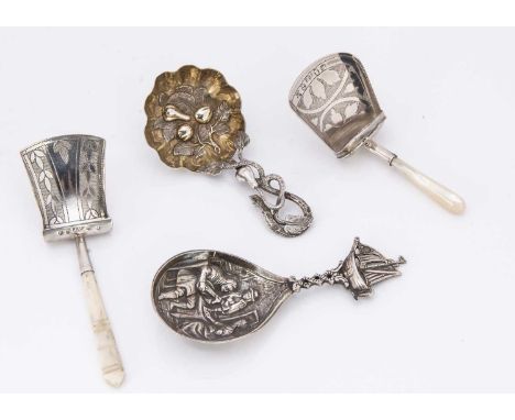 Four Georgian and later silver tea caddy spoons, including a mop and a bone handled example, another continental spoon with b