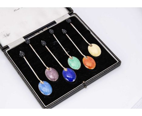 A c1960s set of six silver gilt and enamelled coffee bean spoons in a Harrods case, appear good, some wear to gilding, enamel