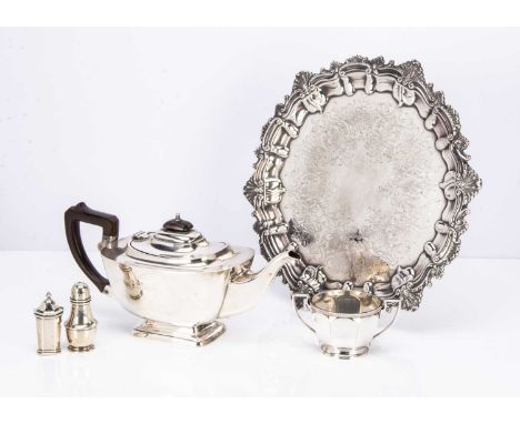 A George V silver teapot, and other items, the teapot well used, 21.25ozt, together with two silver peppers, a silver plated 