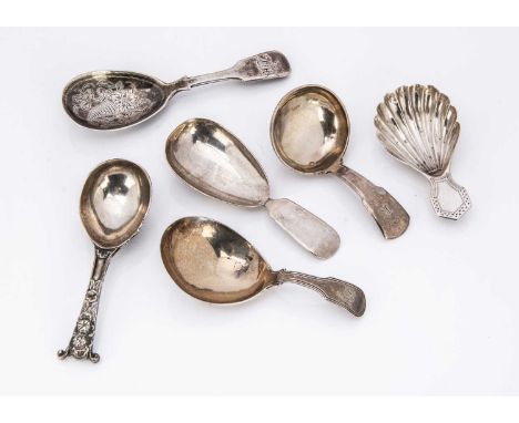 A collection of six Georgian and Victorian silver tea caddy spoons, varying designs