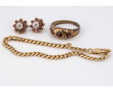 A pair of diamond and ruby earrings, the diamond centres can be removed to wear as studs, a gold plated chain and a silver an