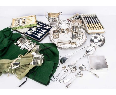 A collection of silver and silver plate, including a dented silver Christening mug, two napkin rings, a cigarette box togethe