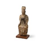 A WOODEN SCULPTURE OF A SCHOLAR, LATE MING DYNASTY, 17TH CENTURY
