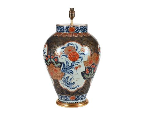 A JAPANESE IMARI VASE FITTED AS A LAMP EARLY 18TH CENTURY 30cm high, excluding fittingA closely related example can be found 