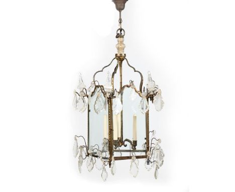 A FRENCH GILT BRASS HALL LANTERN IN LOUIS XV STYLE, 19TH CENTURY Decorated with several cut glass drop pendants 95cm high, 55