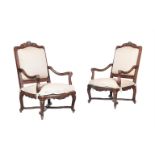 A PAIR OF RÉGENCE CARVED WALNUT FAUTEUILS, CIRCA 1720