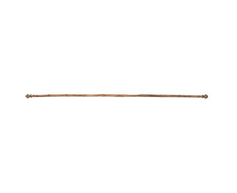 A VICTORIAN BAMBOO AND GILT METAL MOUNTED CURTAIN POLE SECOND HALF 19TH CENTURY 242cm long (This lot is offered without reser