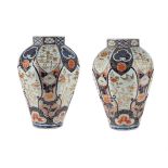 A LARGE PAIR OF JAPANESE IMARI OCTAGONAL PORCELAIN VASES, EDO PERIOD