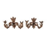 A PAIR OF GILDED WROUGHT IRON WALL LIGHTS, 17TH CENTURY ARMS ON LATER BACKPLATES