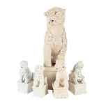 A LARGE CHINESE BLANC DE CHINE DEHUA MODEL OF A BUDDHIST LION INCENSE HOLDER, AND FOUR OTHERS