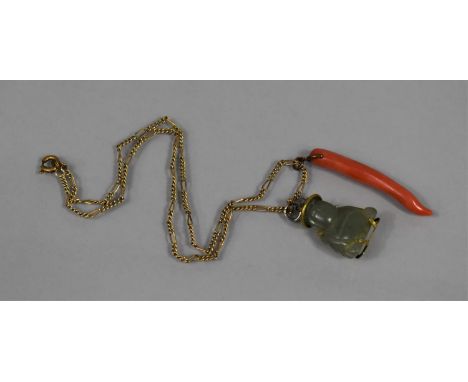 Two Eastern Charms/Pendants. Jade Buddha in a Gilt Metal Mount, Stamped HK to Base and a Red Coral Pendant, 51mm Long 