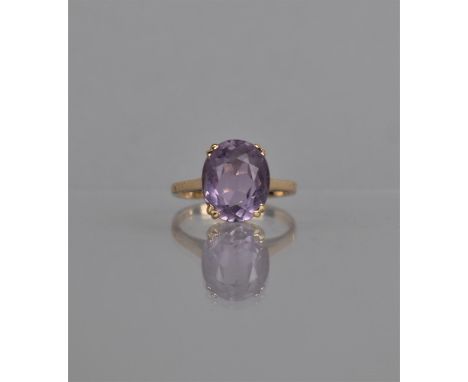 A Vintage 9ct Gold and Amethyst Ladies Dress Ring, Oval Cut Stone 12mm by 10mm, Prong and Basket Setting to Plain Polished Ba