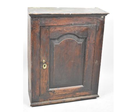 An Early 19th Century Oak Peg Jointed Wall hanging Cabinet with Panelled Door and Two Shelf Interior, 56cms Wide and 70cms Hi